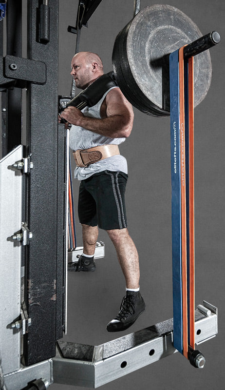 Person using a weight machine with a barbell on a gray background