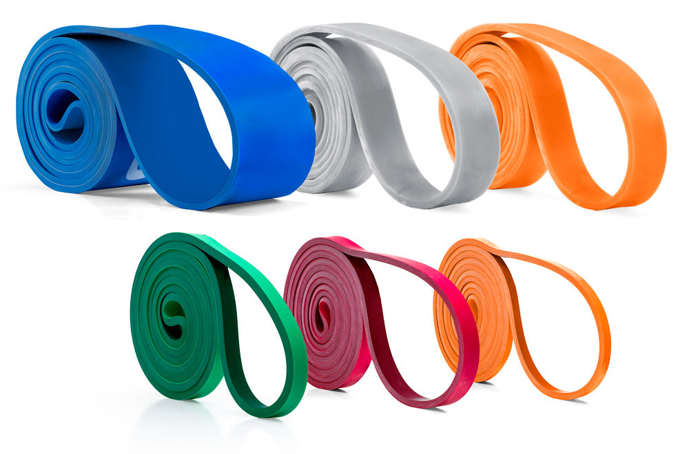 Set of colorful resistance bands on a white background
